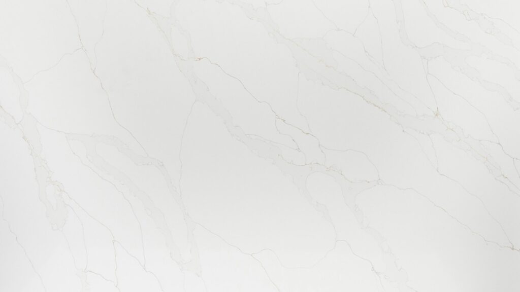 Calacatta Oro quartz worktop slab with white base and gold veining